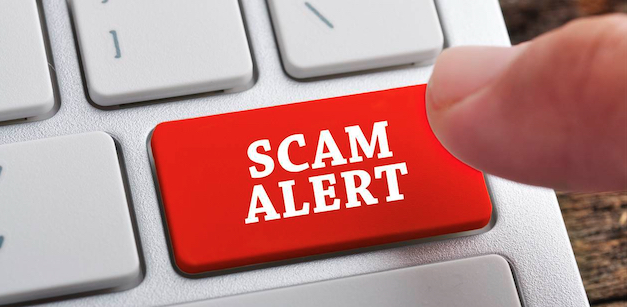 Keyboard with red key SCAM ALERT